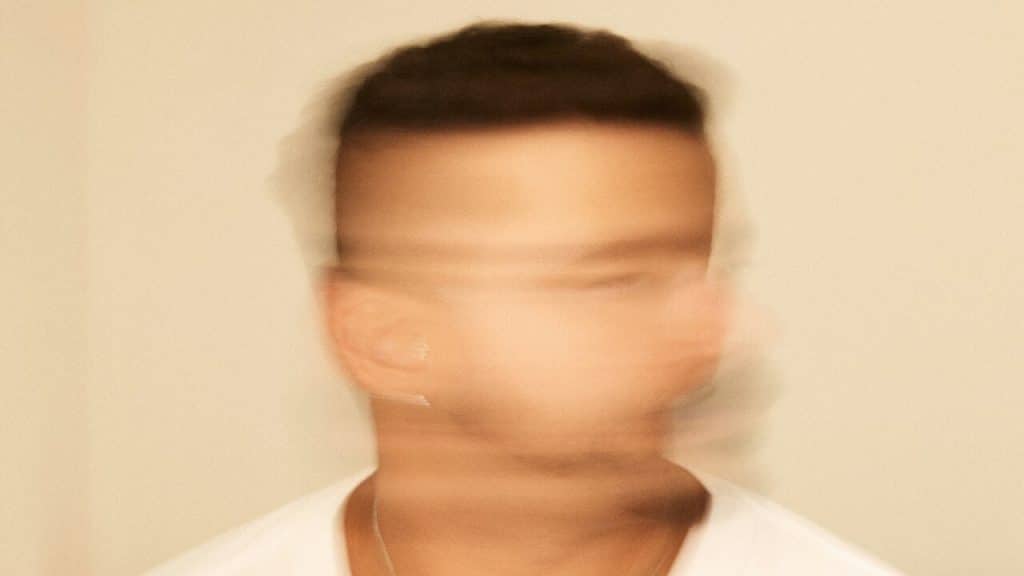 A man shaking his head in refusal