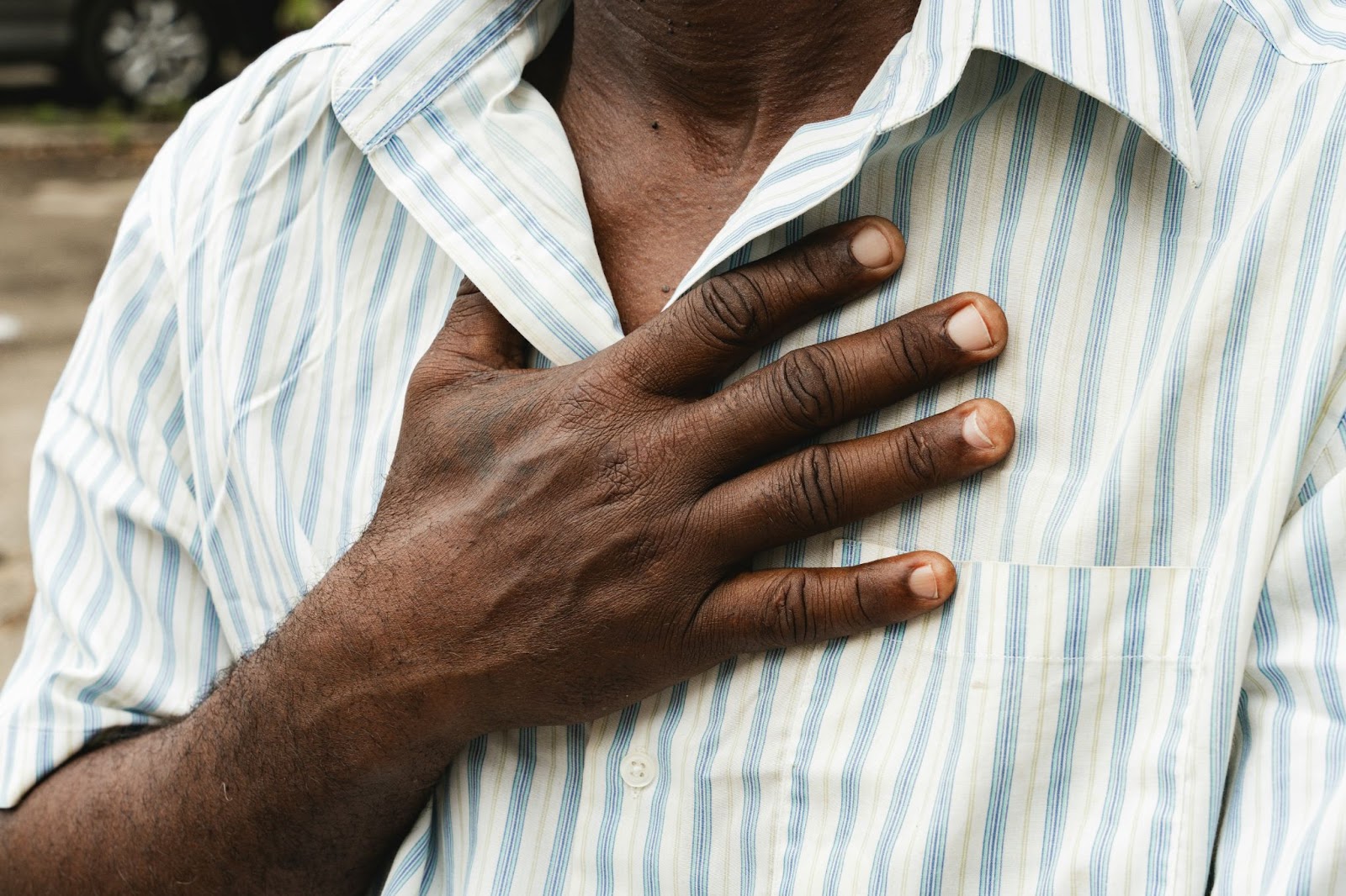 A man holding his chest.