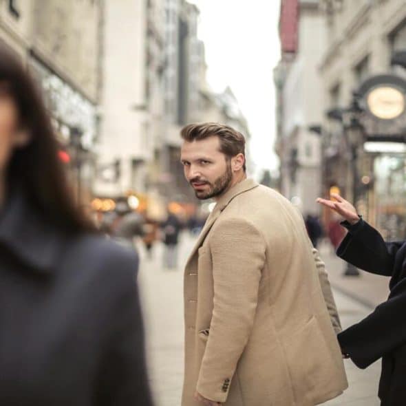 A man looking at another woman.
