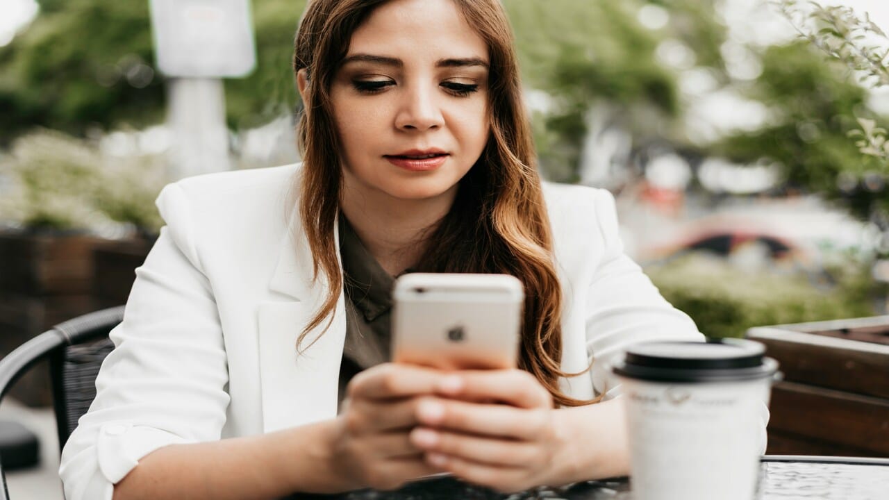 A woman looking at her phone.