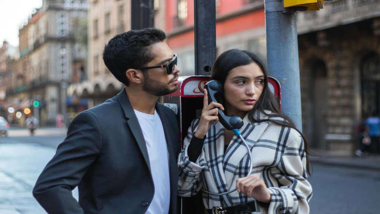 A man looking at a woman, who’s looking at someone else.