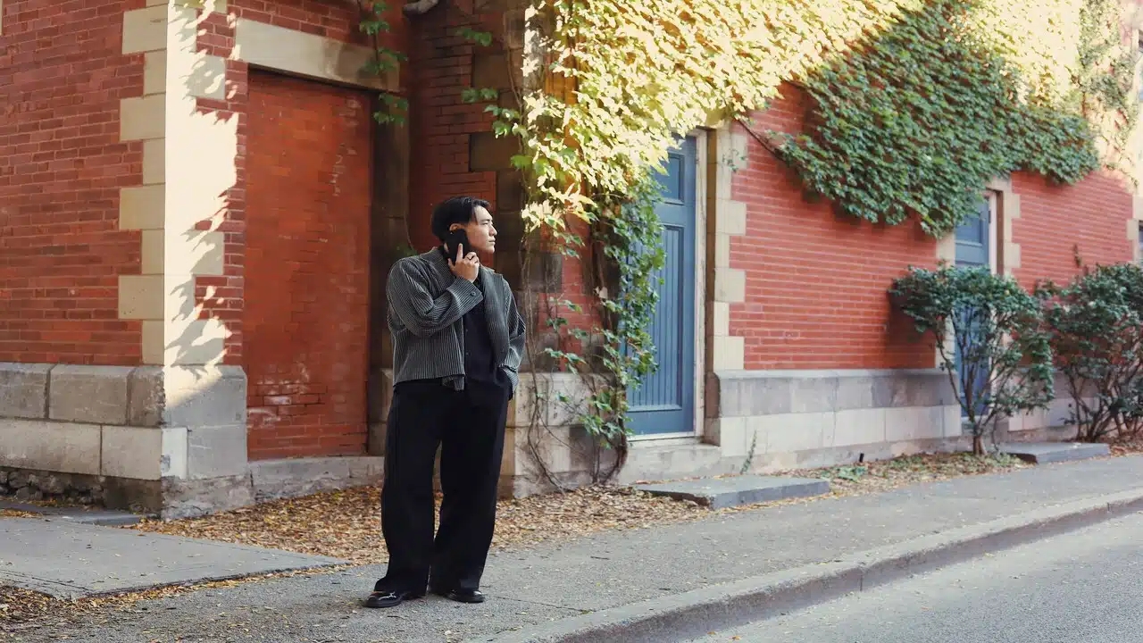 A man waiting for someone on the street.