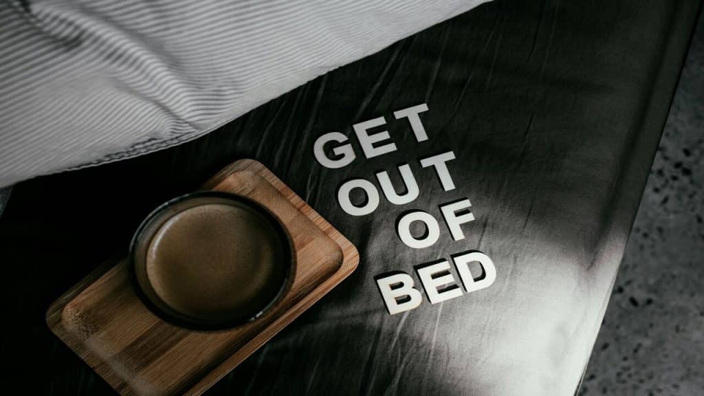 “Get out of bed” written beside coffee