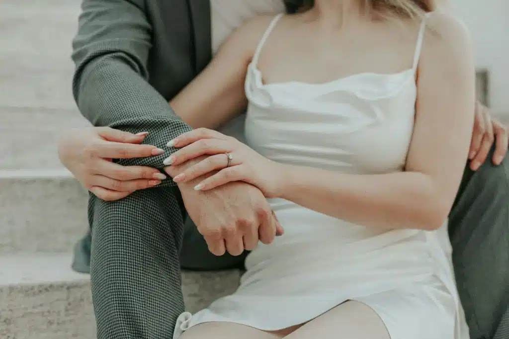 A woman resting on a man’s chest 