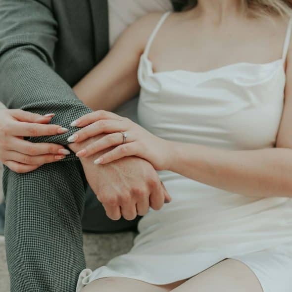 A woman resting on a man’s chest