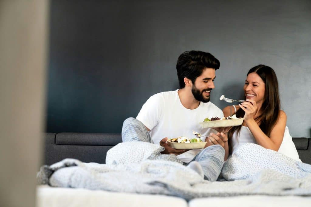 A man and woman eating breakfast together