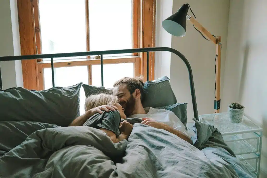 A married couple waking up beside each other