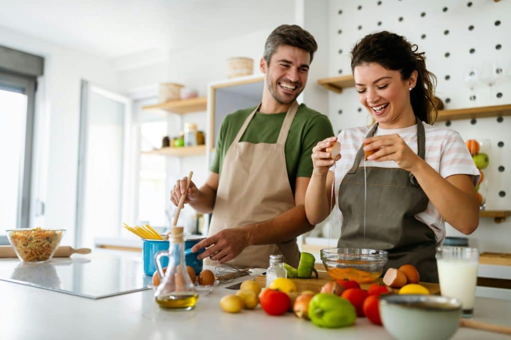 A man and woman cooking together