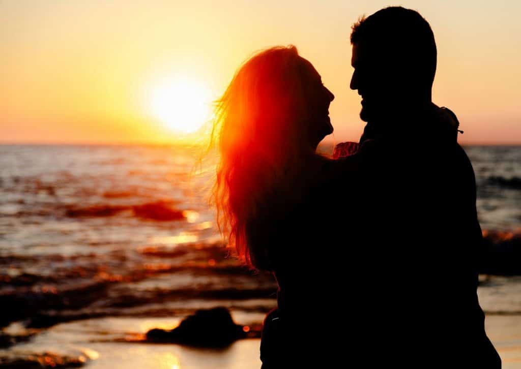 A man and woman’s silhouette from the sunset 