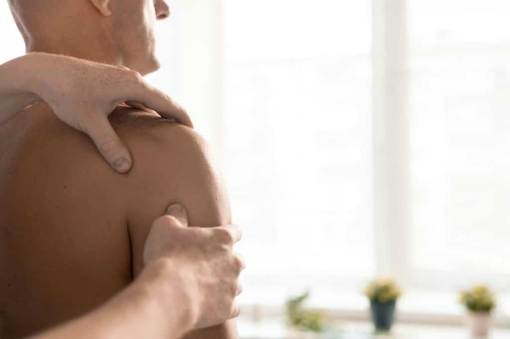 A man having his shoulders check