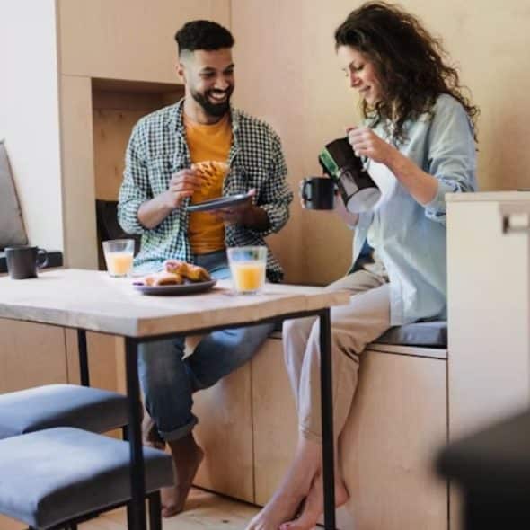 Happy man with partner having breakfast.