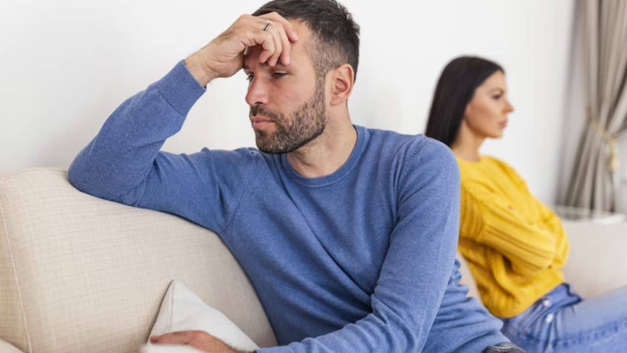 Man avoiding an emotional conversation with partner to keep peace.