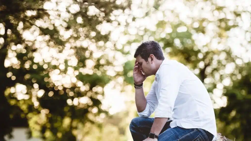 Man sitting alone in thought after an argument
