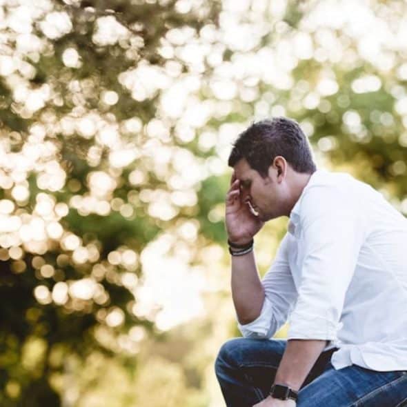 Man sitting alone in thought after an argument
