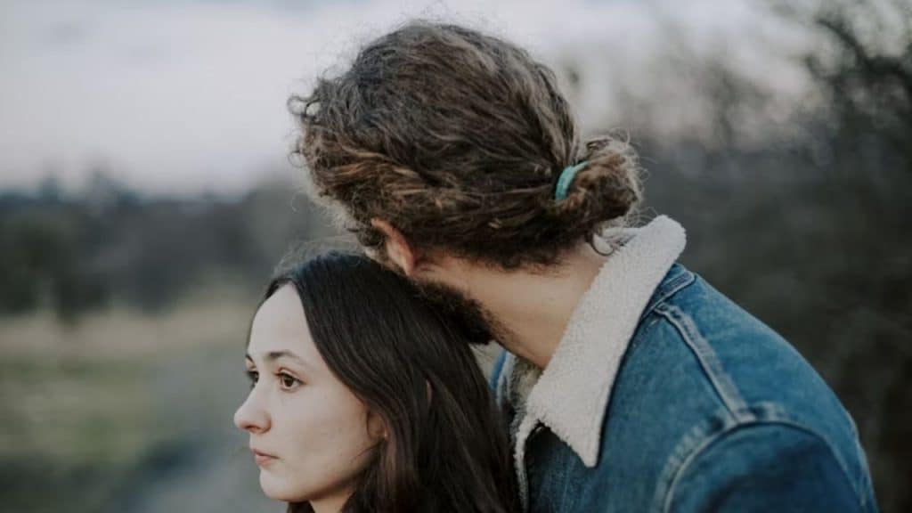 Woman emotionally engaged while man remains silent and passive
