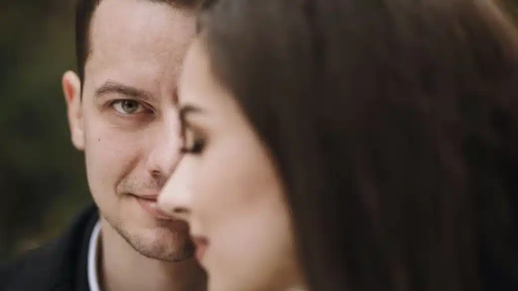 Man awkwardly reacting to a compliment from his partner