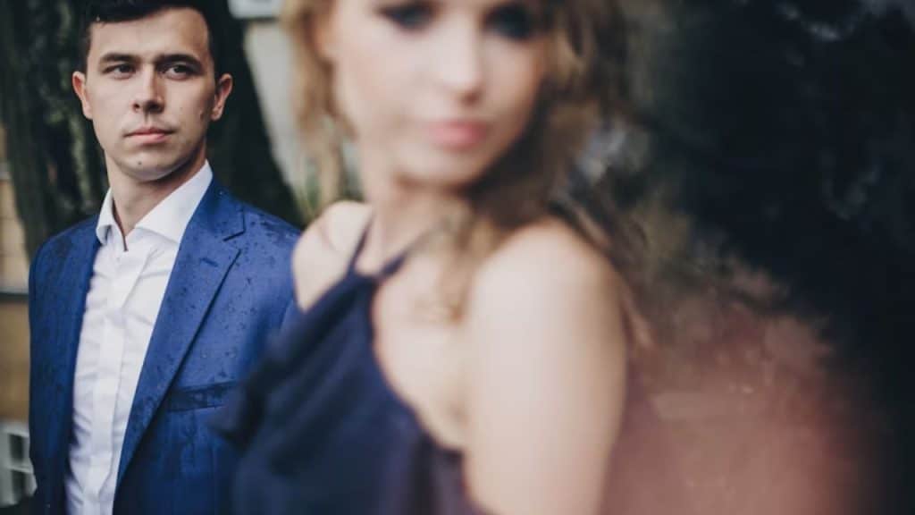 Man using sarcasm to avoid vulnerability in a relationship conversation