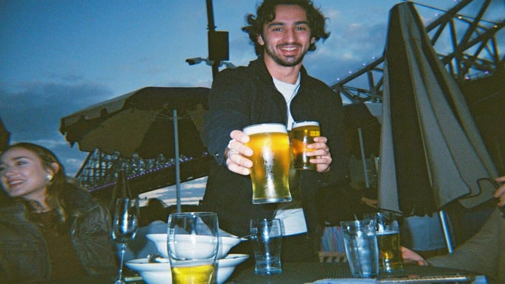 A man having beer with friends.