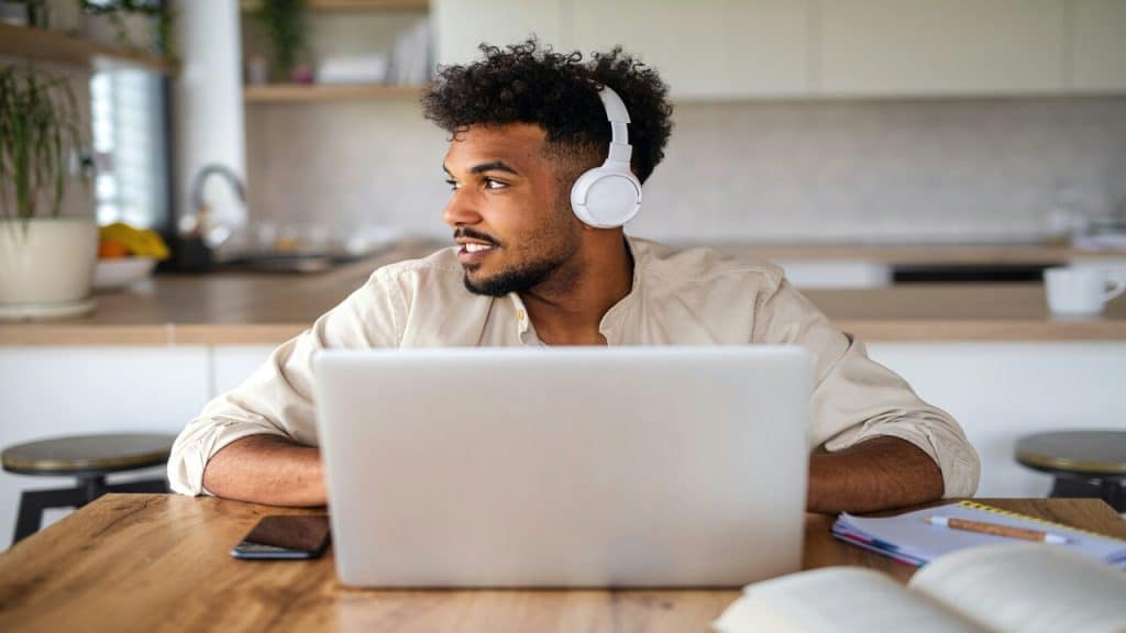A man attending an online class.