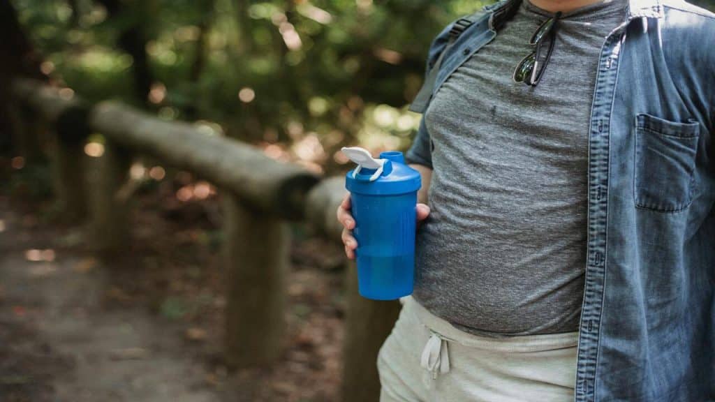 A man holding a water bottle