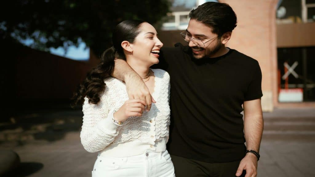 A couple laughing together.