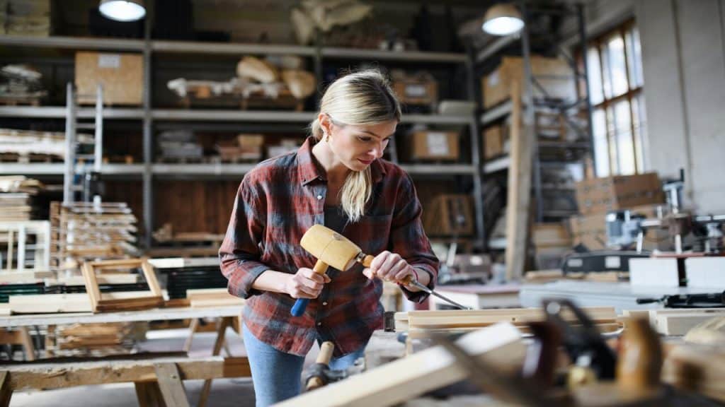 A woman using power tools.