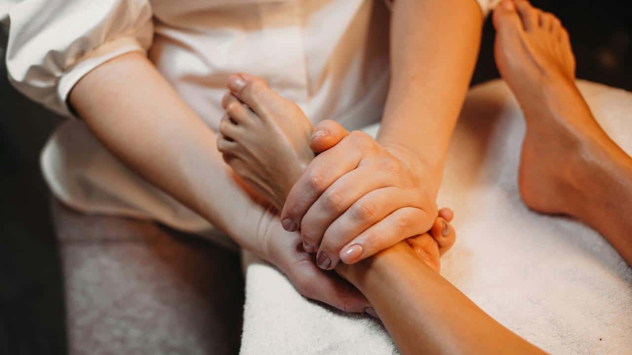 A person receiving a foot massage.