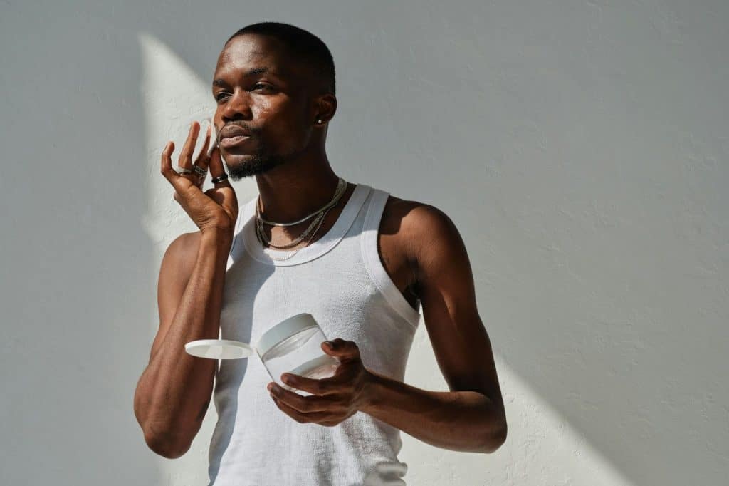 A man using an alcohol-based toner