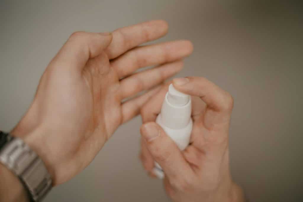 A man holding a moisturizer