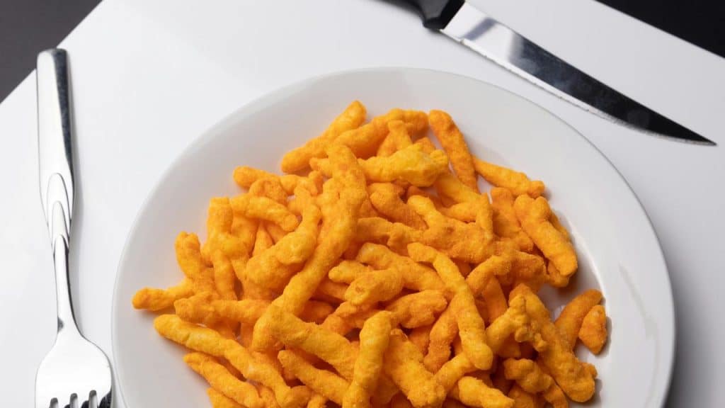 A plate of cheesy snack sticks.