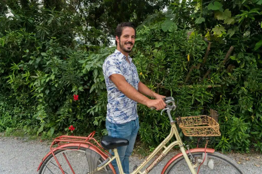 A man holding a bicycle