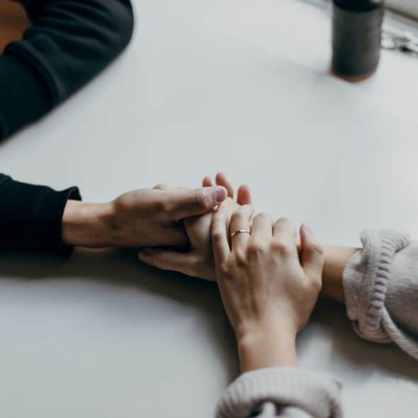 Couple holding hands