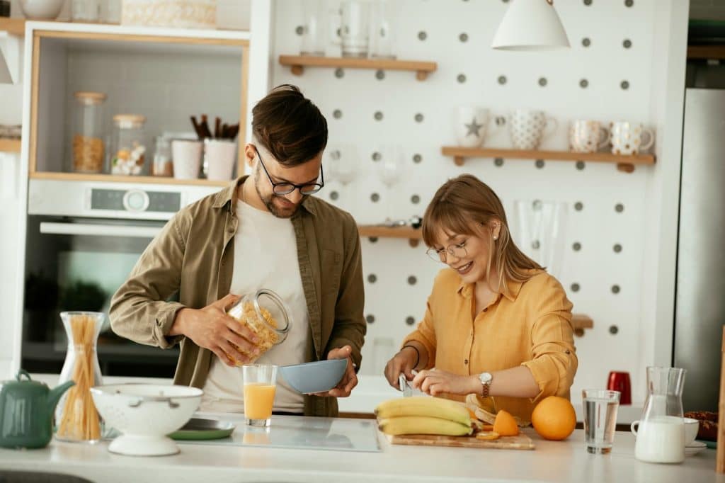 A man and woman at the kitchen