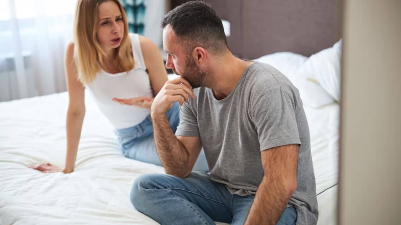 Man feeling emotionally silenced during tense relationship moment.