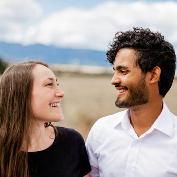 A man and woman looking at each other