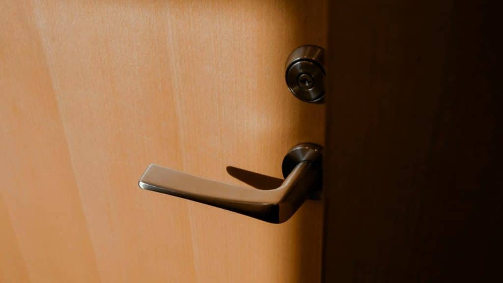 A close-up photo of a door handle exposed by sunlight.