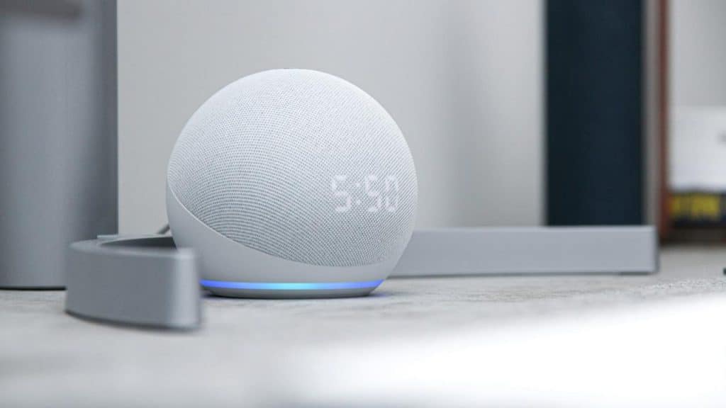 A close-up photo of a smart speaker that displays time.