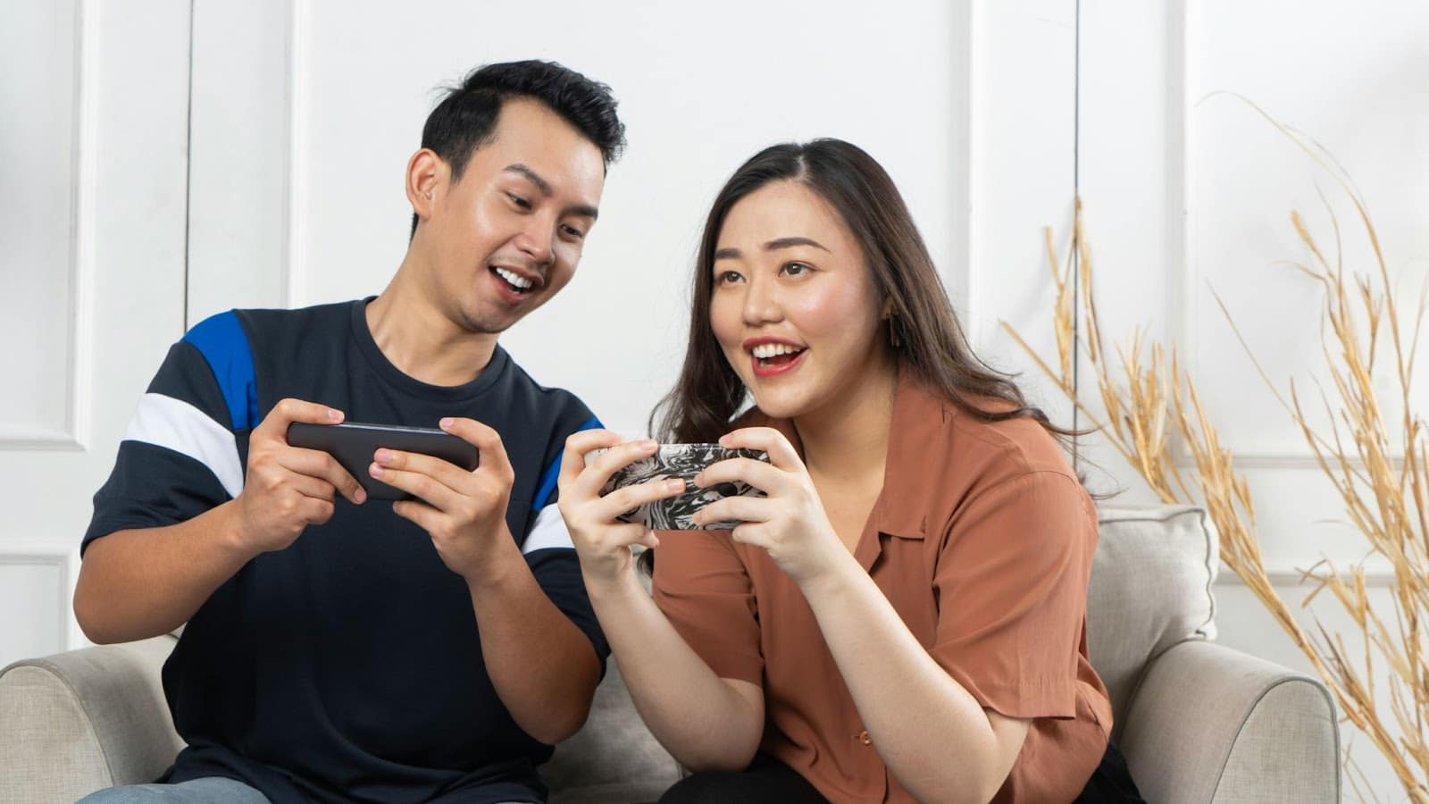 A man and woman playing videogames.