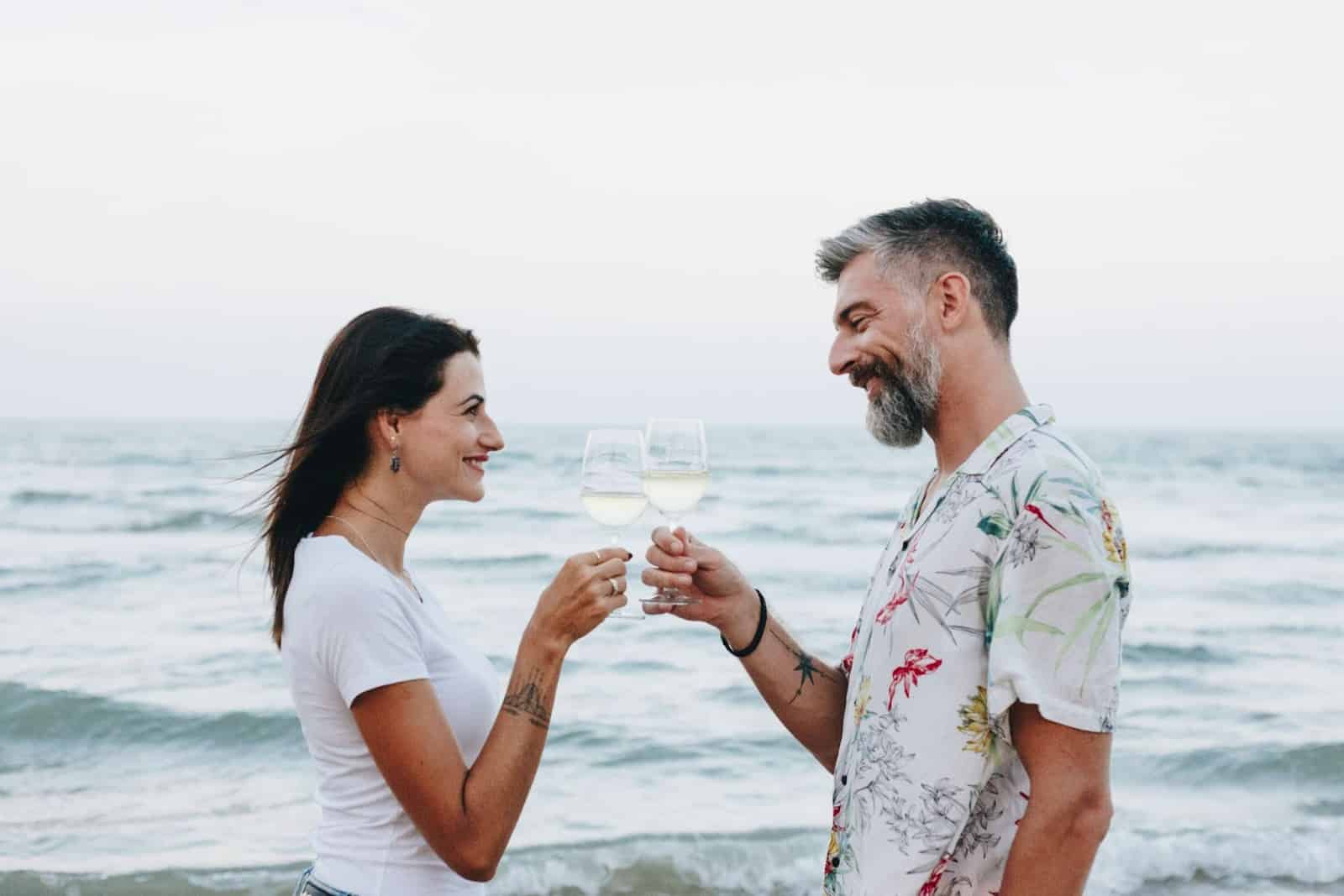 A man and woman toasting.