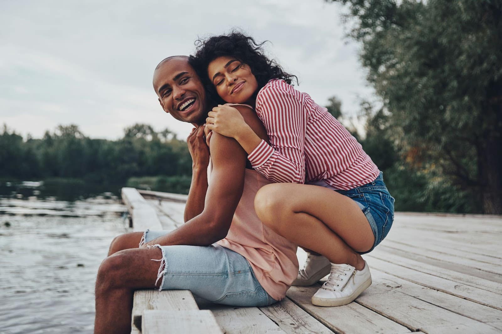 A woman hugging a man.