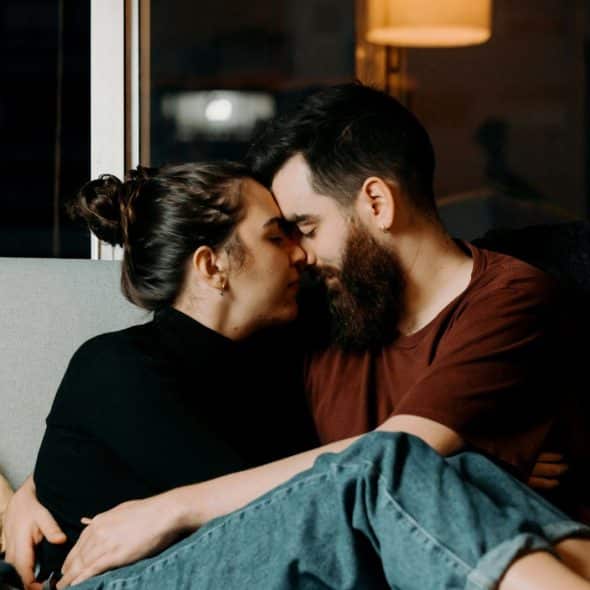 A man and woman facing each other