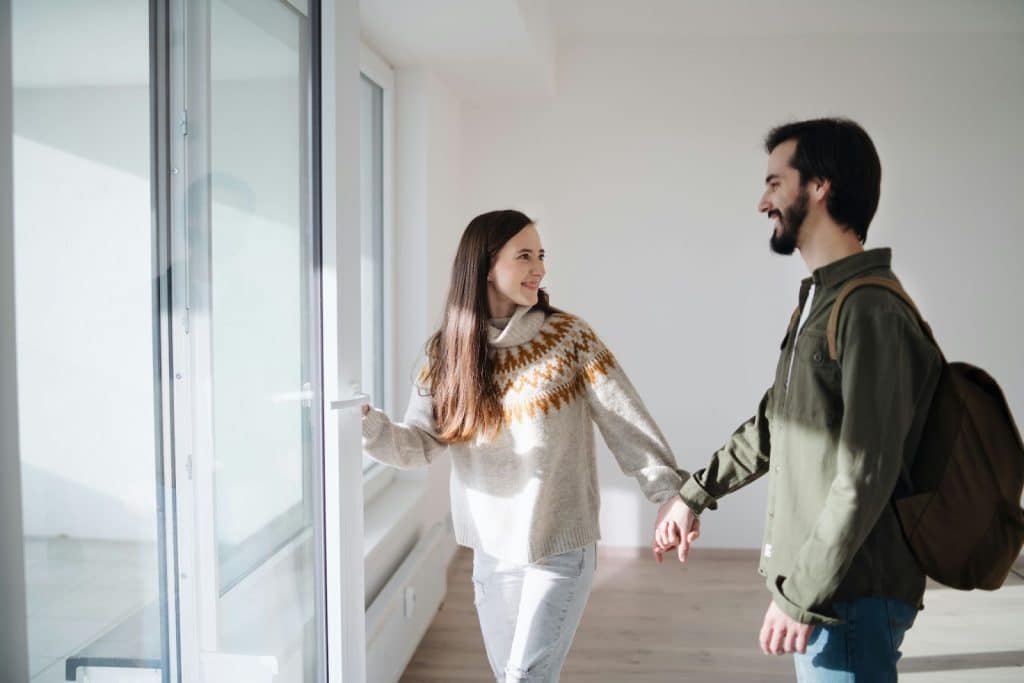 A man and woman smiling at each other 