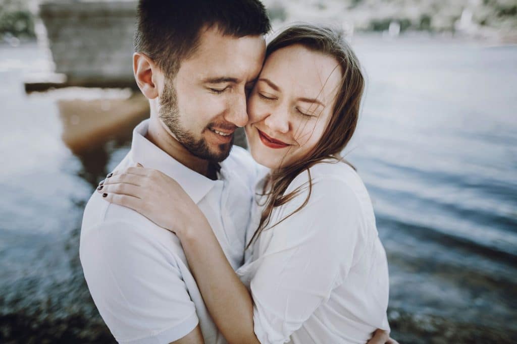 A man hugging a woman