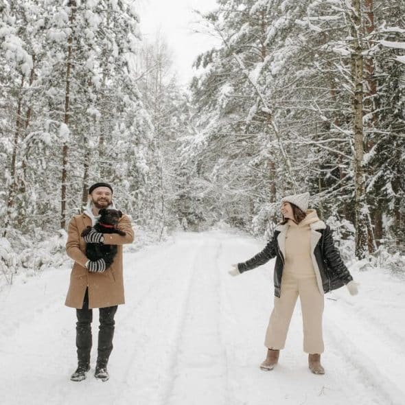 A couple walking on a snowy pathway