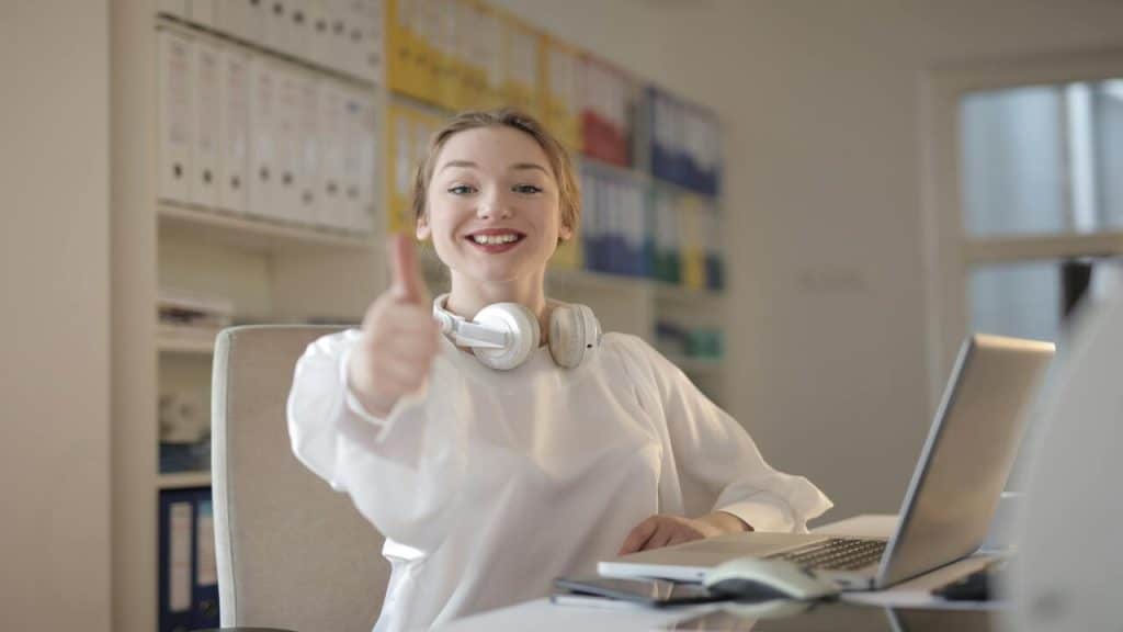 A woman doing the thumbs up sign