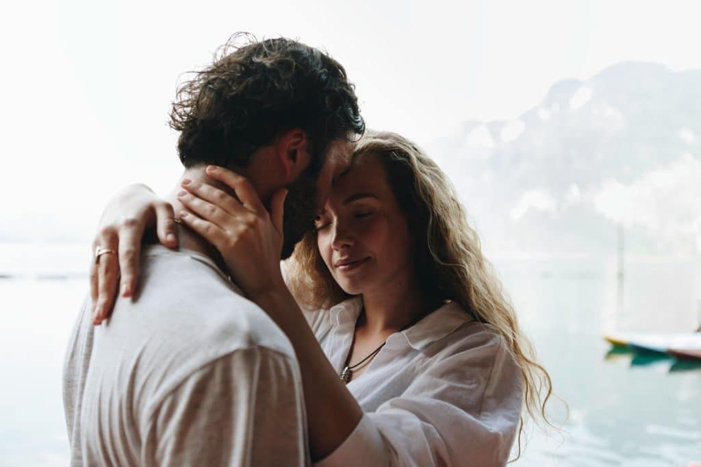 A man and woman close to each other.