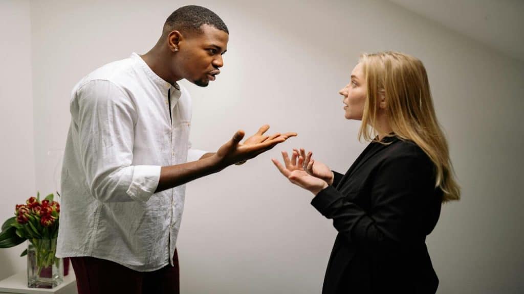 A couple arguing in the living room