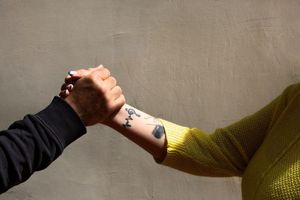 A man and woman holding hands.