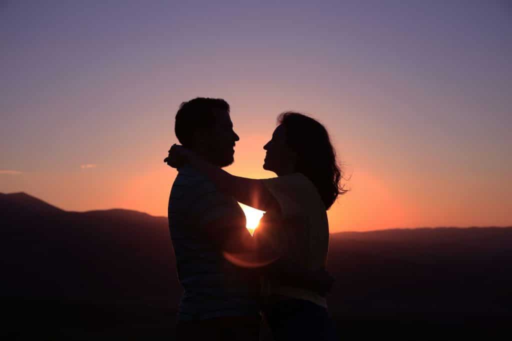 A silhouette of a man and woman.