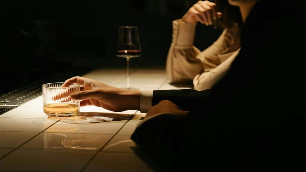 A man and a woman at a bar.